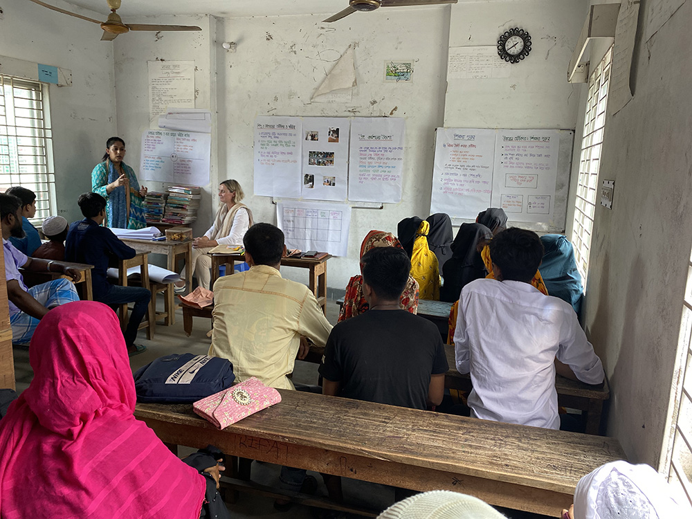 Speaking to youth ahead of a factory-based youth development programme in Bangladesh